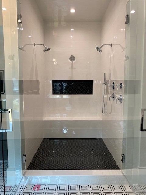 Bathroom remodel with tile flooring around a clawfoot tub