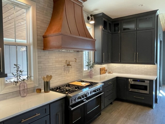 Custom kitchen with hardwood flooring by Prestigious Flooring & Design